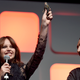 Felicity Jones proudly holds her Jyn Erso action figure aloft at Star Wars Celebration.